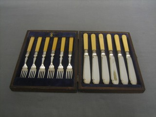 A set of 6 silver plated fish knives and forks contained in an oak canteen box