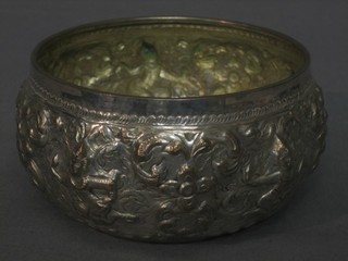 A circular Eastern embossed silver bowl decorated figures 4 ozs