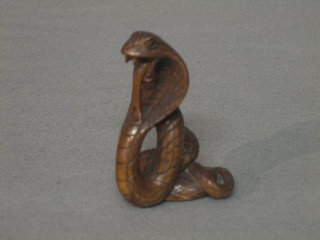 A reproduction carved wooden Netsuke in the form of a serpent 2"