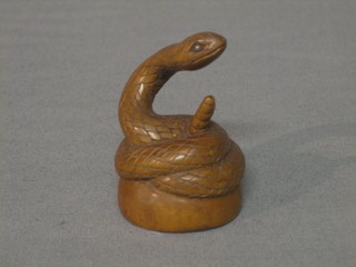 A reproduction carved wooden Netsuke in the form of a Cobra 2"