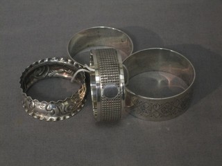 4 various silver napkin rings 2 ozs