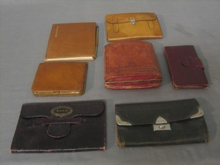 4 leather wallets, a leather needle case, a pair of leather bookends  and a leather telephone book