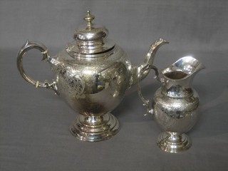 A Victorian engraved oval silver plated coffee pot together with matching cream jug