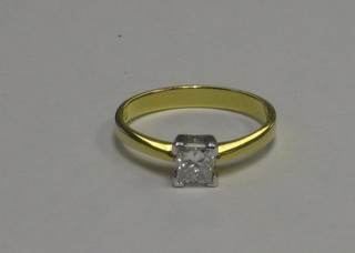 A lady's 18ct yellow gold dress ring set a square cut diamond