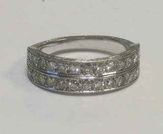 An 18ct white gold or platinum half eternity dress ring set 2 rows of diamonds