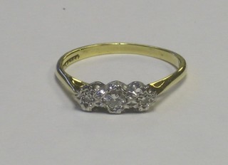 An 18ct gold dress ring set 3 diamonds