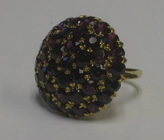 A lady's 18ct yellow gold cluster dress ring set garnets