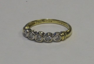 A lady's 18ct gold 5 stone dress ring set diamonds