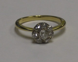 An Edwardian gold cluster dress ring set diamonds