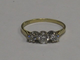 A lady's 9ct gold dress ring set 3 diamonds