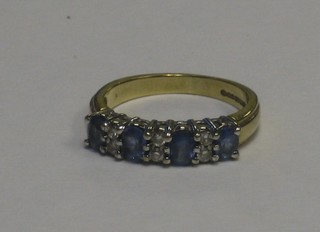 A lady's 9ct gold sapphire and diamond half eternity ring