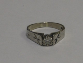 An 18ct white gold dress ring set an illusion set diamond