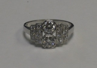 An 18ct white gold Art Deco style dress ring set 2 large circular cut diamonds supported by 2 rows of circular cut diamonds approx 1ct