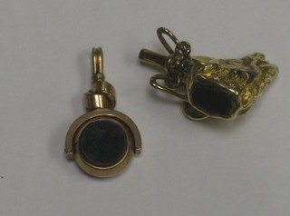 A 19th Century gilt metal watch key in the form of a wild boar's gead together with a gilt metal double seal