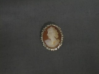 A shell carved cameo brooch/pendant contained in a silver mount