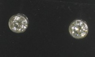 A pair of circular diamond stud earrings set in 18ct gold approx 0.42ct