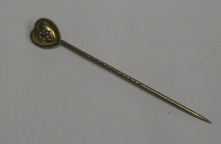 A heart shaped stick pin