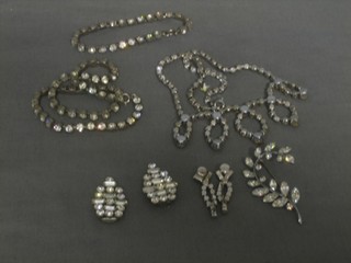 2 diamonte necklaces, a diamonte bracelet, brooch and 2 ear clips