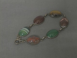 A silver bracelet set cabouchon cut hardstones