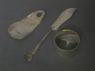 A silver shoe horn, a silver napkin ring and a silver butter knife