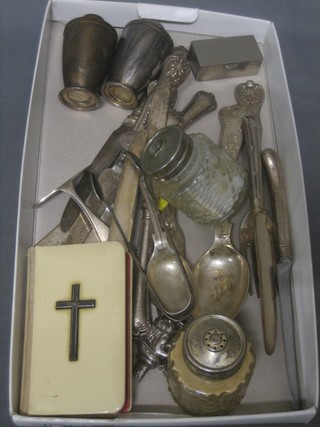 A book of Common Prayer with ivory cover and decorated a silver cross, a silver plated salt and pepper, a silver plated rattle with mother of pearl teething bar and a collection of flatware 