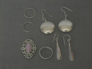 2 pairs of silver earrings and 3 silver dress rings