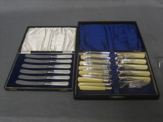 A set of 6 silver plated fish knives and forks and 6 tea knives with mother of pearl handles