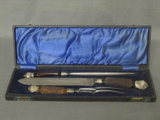 A Victorian 3 piece cased carving set with stag horn handle