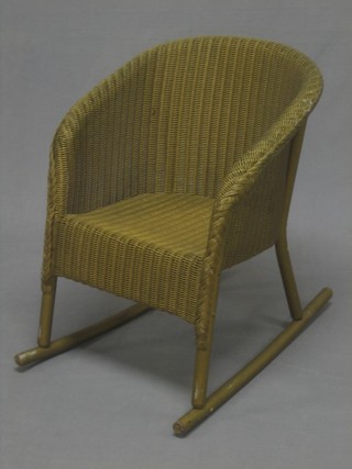 A childs gold painted Lloyd Loom rocking chair