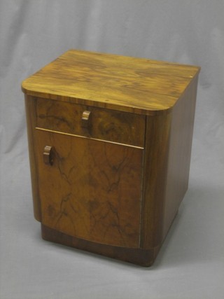An Art Deco walnut D shaped bedside cupboard fitted a drawer 16"