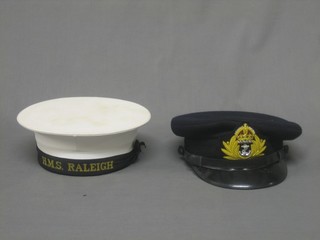 A Naval ratings cap with HMS Raleigh cap title and a reproduction WWII Naval Officer's cap 