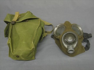 A Service respirator head piece contained in a webbing bag