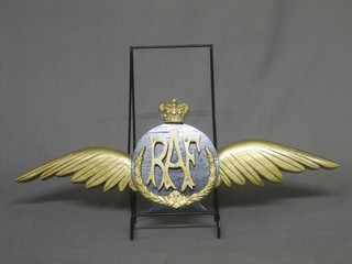 A carved wooden painted plaque in the form of RAF wings 20"