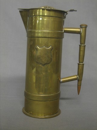 A Trench Art jug formed from a shell case marked The Somme 1916 and with a Royal Army Service Corps cap badge to top, 9" overall 