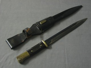 A German bayonet with 10" straight blade marked 4440 complete with metal scabbard and leather frog 