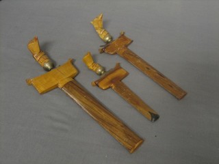 3 various miniature Kris, 2 at 7" 1 at 4" (3), all in hardwood scabbards