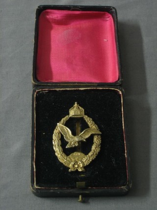 A silver gilded Marine Retired Pilot's badge cased