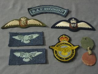 A pair of RAF wings, a reproduction pair of RAF Sea Wings, an RAF cloth shoulder title, 2 shoulder badges etc