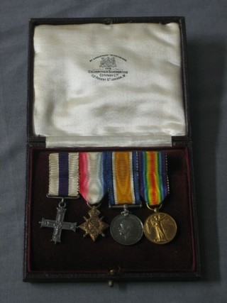 A group of 4 miniature medals comprising Military Cross 1914-15 Star, British War medal and Victory medal, contained in original Garrards case