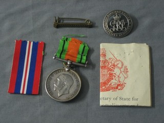 A pair to 515017 Pte. A J C McPherson 17th London Regt. comprising British War medal and Victory medal together with a WWI discharge badge and a WWII medal certificate