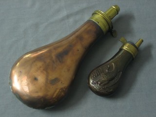 A 19th Century copper powder or shot flask with brass mount (f) and a reproduction copper and brass powder flask decorated an eagle