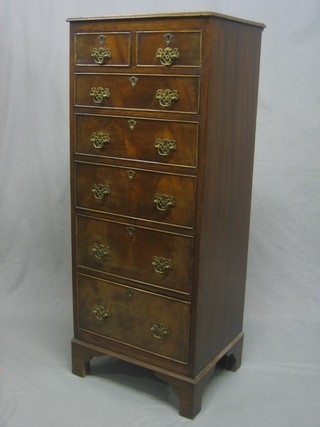 A Georgian style mahogany pedestal chest with crossbanded top, fitted 2 short and 5 long drawers, raised on bracket feet 18 1/2"