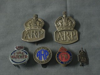 A small ARP badge, 2 large ARP badges, 2 Fire Watchers badges and a The Times ARP badge