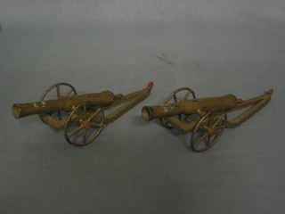 2 metal model canons 9"