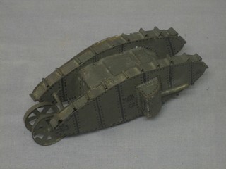 A wooden model of a WWI tank 7"