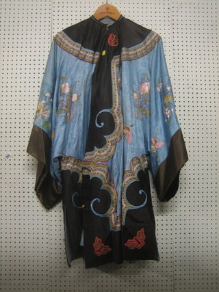 An Oriental embroidered silk jacket 