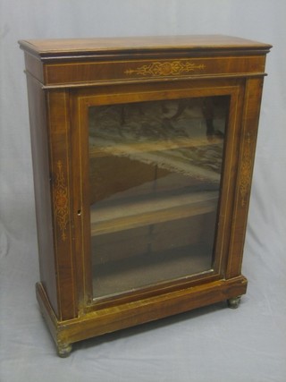 A Victorian inlaid walnut Pier cabinet, fitted adjustable shelves enclosed by a glazed panelled door, raised on a platform base 29"