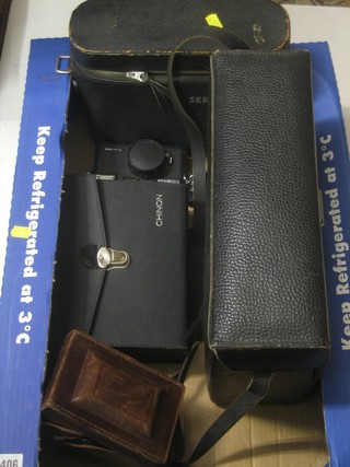 A Chinon camera, do. cine camera, a cine camera, a Schneider zoom 8 cine camera and a Rolleiflex type camera