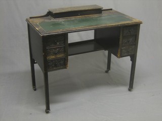 A 19th Century carved oak writing table, the back fitted a stationery box and with inset tooled leather writing surface, above 3 long drawers, raised on square tapering supports 36"