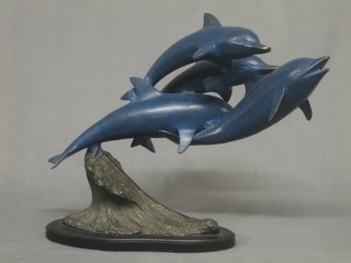 A modern metal figure group of diving dolphins 17"
